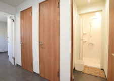 Three shower stalls for both men and women.